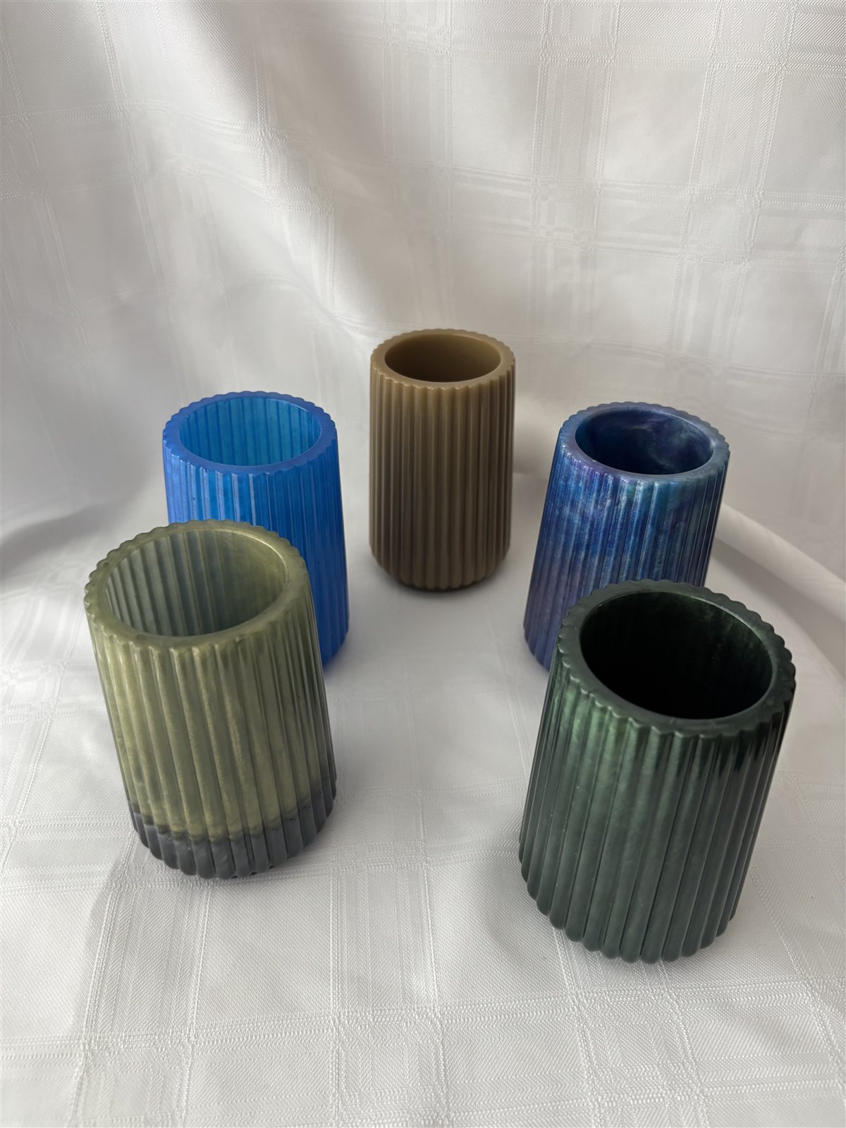 Five ribbed resin vases in blue, navy, sand, olive and forest green